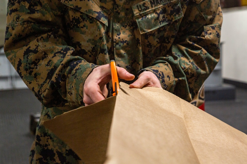 15th MEU infantry Marines build terrain model aboard USS Makin Island