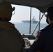 Bahrain Coast Guard escorts the USS Nimitz through the Gulf of Bahrain for maintenance and logistics visit