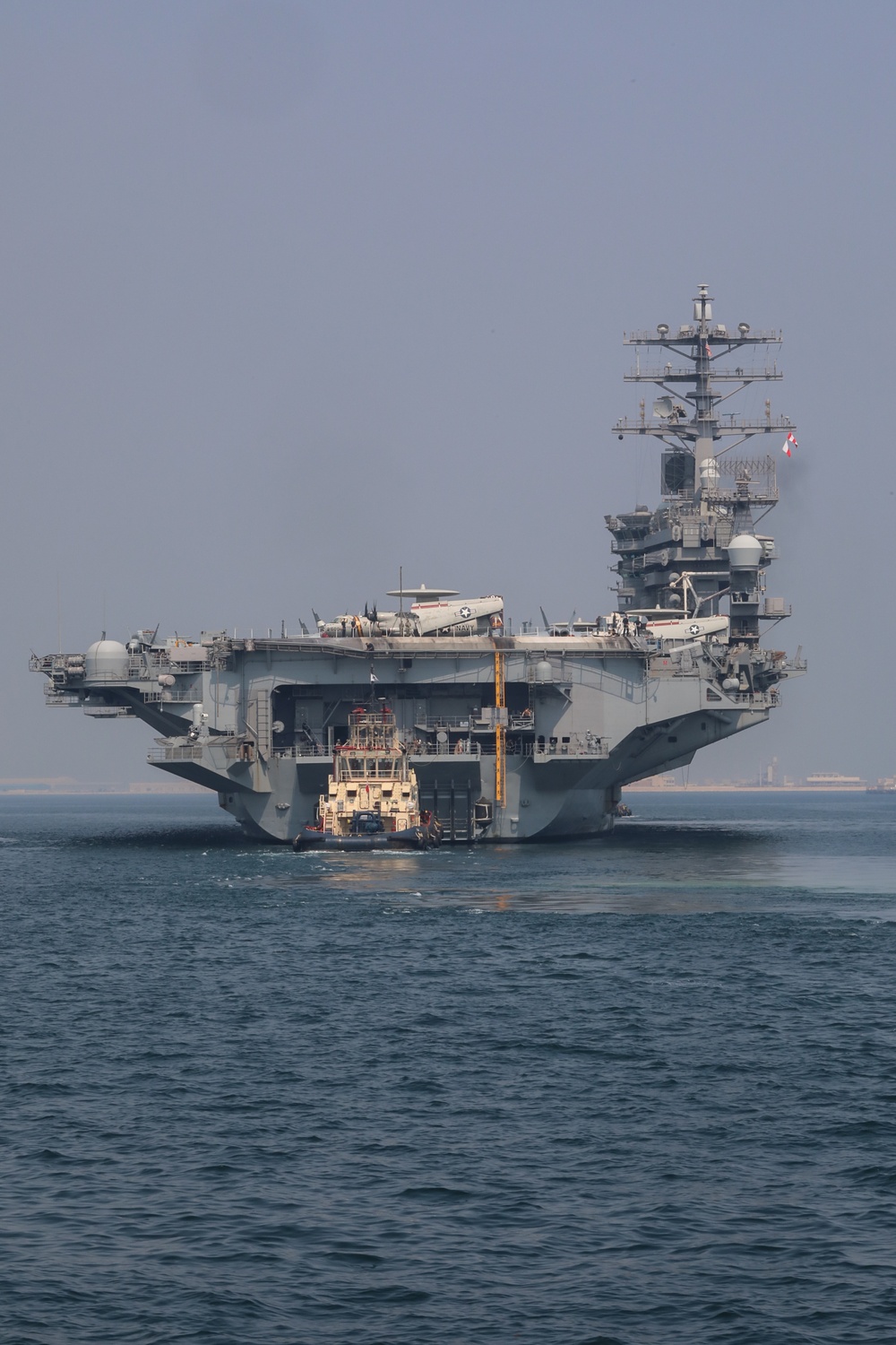 Bahrain Coast Guard escorts the USS Nimitz through the Gulf of Bahrain for maintenance and logistics visit