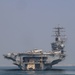 Bahrain Coast Guard escorts the USS Nimitz through the Gulf of Bahrain for maintenance and logistics visit