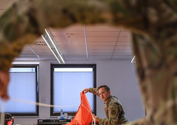 52nd OSS Aircrew Flight Equipment Rigged to Save Lives