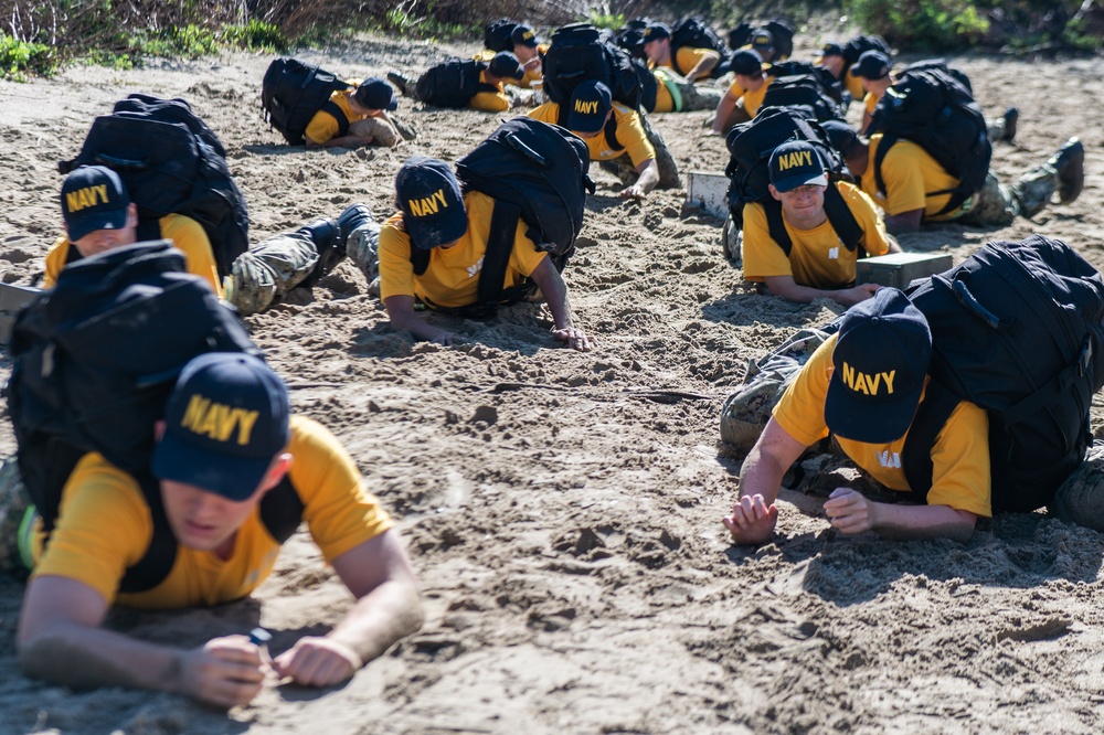 201014-N-TE695-0041 NEWPORT, R.I. (Oct. 14, 2020)  Navy Officer Candidate School (OCS) students manuver to extraction during battle stations