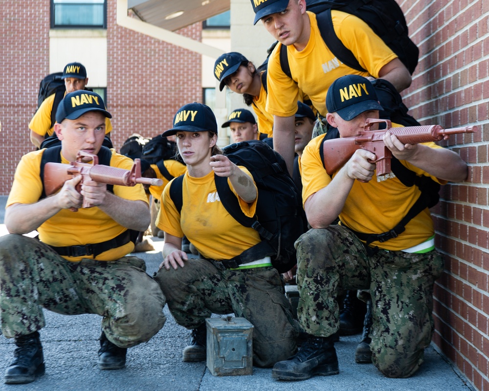 201014-N-TE695-0044 NEWPORT, R.I. (Oct. 14, 2020)  Navy Officer Candidate School (OCS) students manuver to extraction point during battle stations