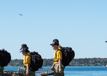 201014-N-TE695-0067 NEWPORT, R.I. (Oct. 14, 2020)  Navy Officer Candidate School (OCS) students manuver to extraction point during battle stations