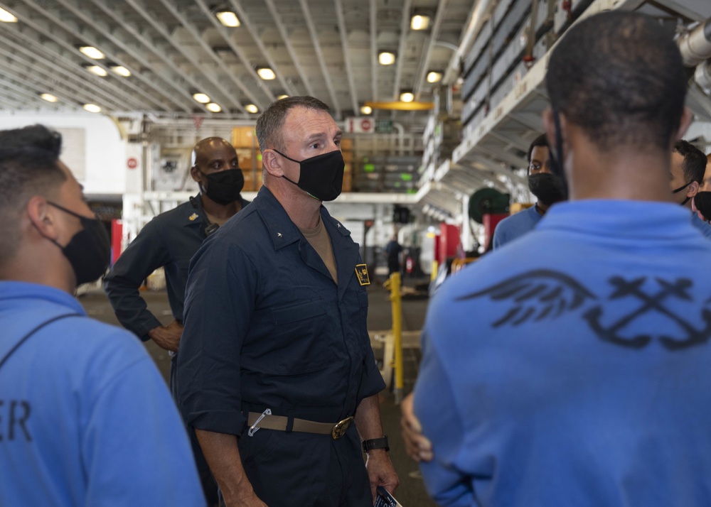 Commander, Naval Surface and Mine Warfighting Development Center Rear Adm. Scott Robertson tours the Iwo Jima