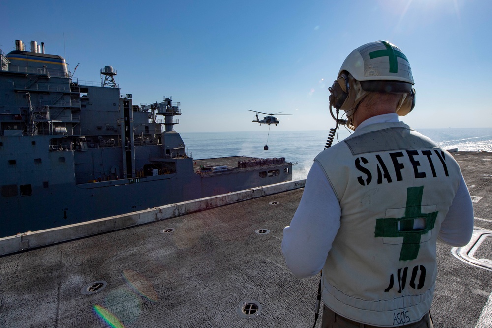 Officer Oversees Vertical-Replenishment-At-Sea