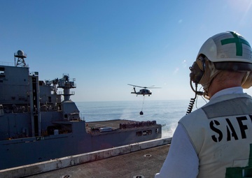 Officer Oversees Vertical-Replenishment-At-Sea