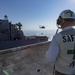 Officer Oversees Vertical-Replenishment-At-Sea