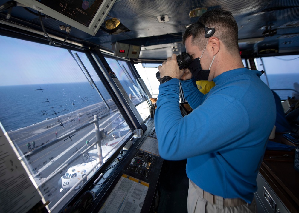 Sailor Scans Flight Deck