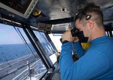 Sailor Scans Flight Deck