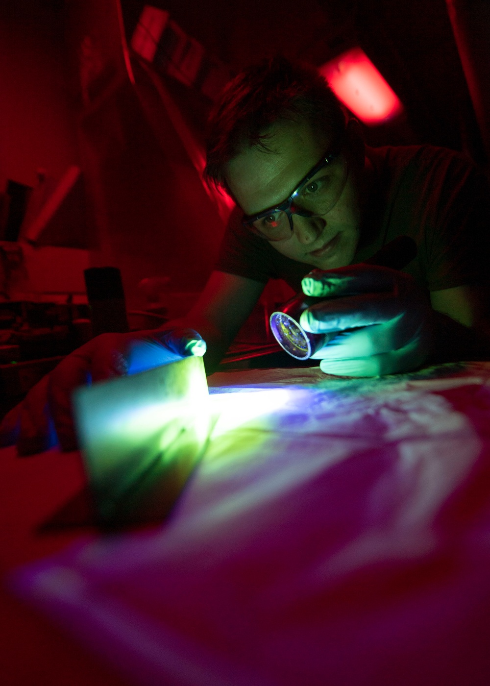 Sailor Inspects Weld Repair With Fluorescent Penetrant