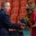 Air Force colonel presents flowers to daughter