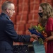 Air Force colonel presents flowers to daughter