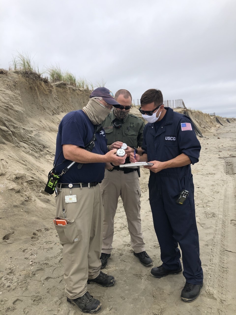 Coast Guard, Delaware Department of Natural Resources and Environmental Control overseeing cleanup of oil patties on Broadkill Beach, Delaware