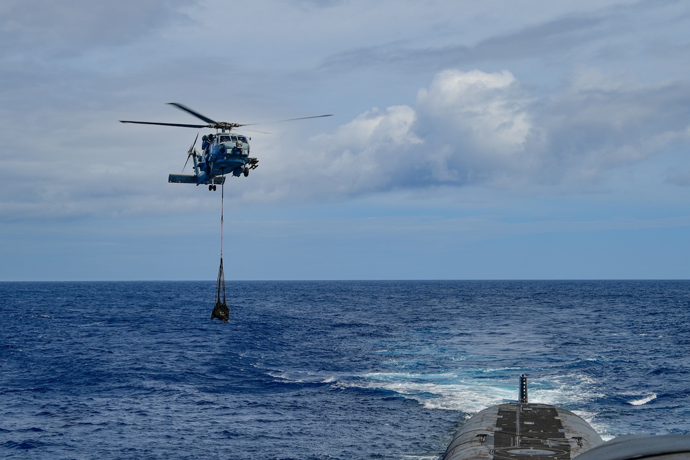 An MH-60R Sea Hawk Delivers a Payload to USS Henry M. Jackson