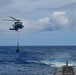 An MH-60R Sea Hawk Delivers a Payload to USS Henry M. Jackson