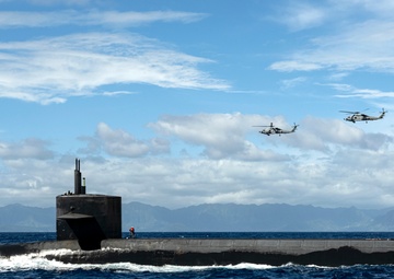 An MH-60R Sea Hawk Delivers a Payload to USS Henry M. Jackson