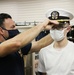 201017-N-KV911-0018 NEWPORT, R.I. (Oct. 17, 2020)  Navy Officer Candidate School (OCS) student is fitted for a combination cover