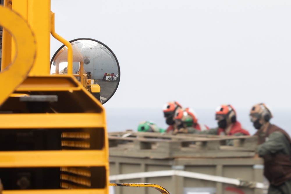 15th MEU Marines, USS San Diego Sailors unload helicopters while underway
