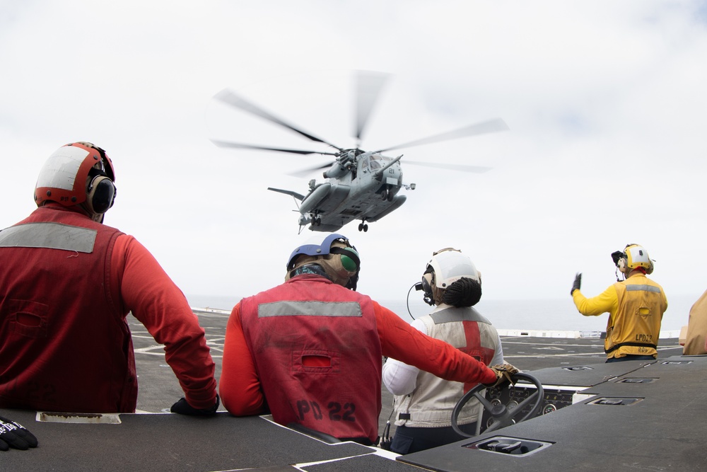 15th MEU Marines, USS San Diego Sailors unload helicopters while underway