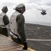 15th MEU Marines, USS San Diego Sailors unload helicopters while underway