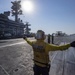 Sailor Directs E-2C Hawkeye