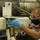 Sailor Performs Corrosion Treatment