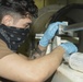 Sailor Performs Corrosion Treatment