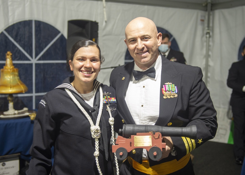 Boatswain’s Mate 2nd Class Jacklyn Ditzel (left) assigned to USS Constitution, is awarded Sailor of the Year by the 76th commanding officer of USS Constitution, Cmdr. John A. Benda (right)