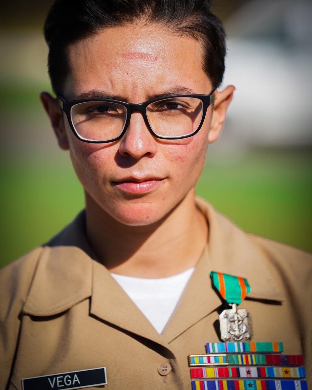 Staff Sergeant Megan Vega is presented a Navy and Marine Corps Achievement Medal