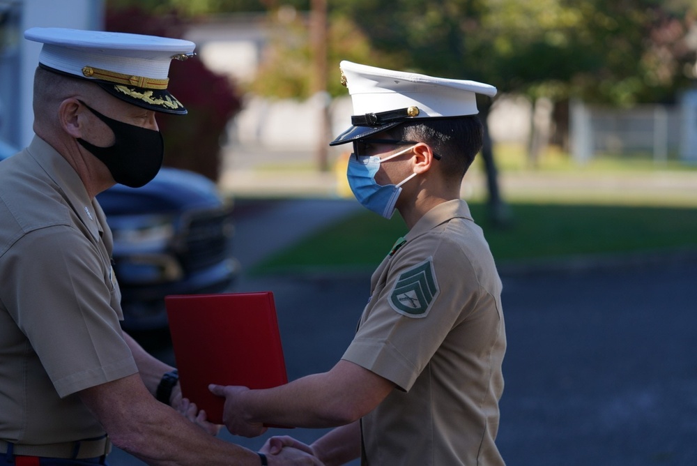 Staff Sergeant Megan Vega is presented a Navy and Marine Corps Achievement Medal