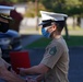 Staff Sergeant Megan Vega is presented a Navy and Marine Corps Achievement Medal