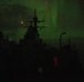 USS Ross (DDG 71) under the Aurora Borealis.