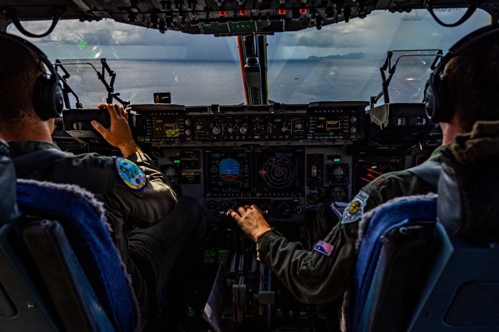 C-17 Globemaster III Airdrops Payload to USS Henry M. Jackson