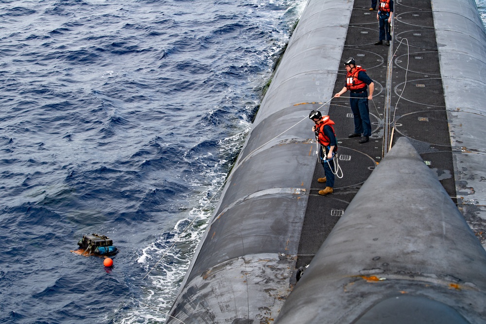 C-17 Globemaster III Airdrops Payload to USS Henry M. Jackson