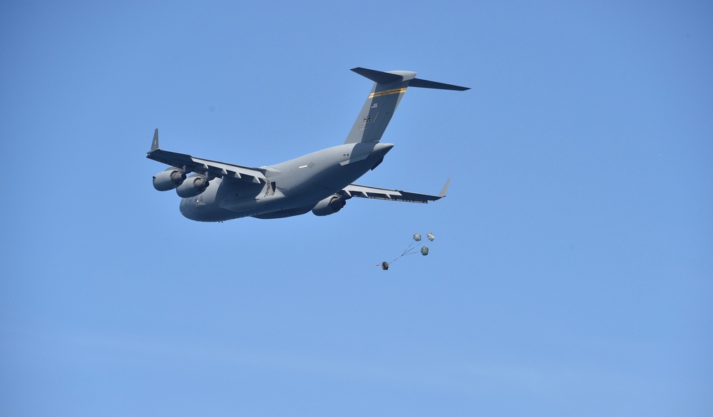 C-17 Globemaster III Airdrops Payload to USS Henry M. Jackson