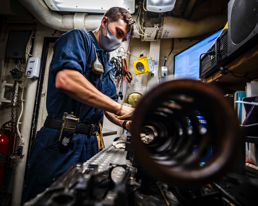 Sailors conduct daily maintenance aboard McCain