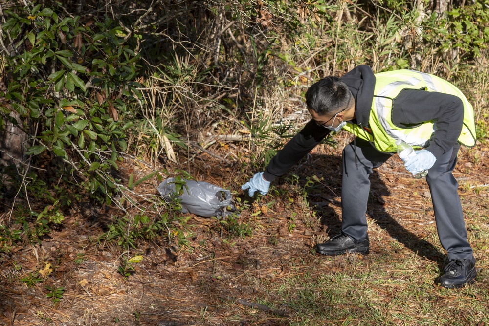 Volunteers with MCB Camp Lejeune clean up trash along Holcomb Blvd.