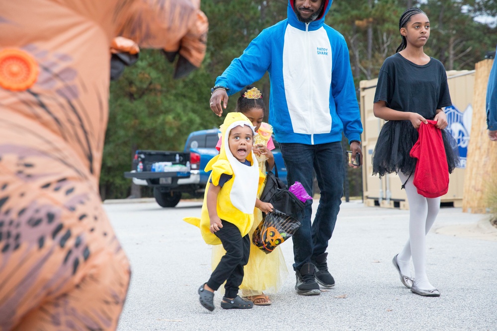 Families walk through the All American Haunted Lane Event