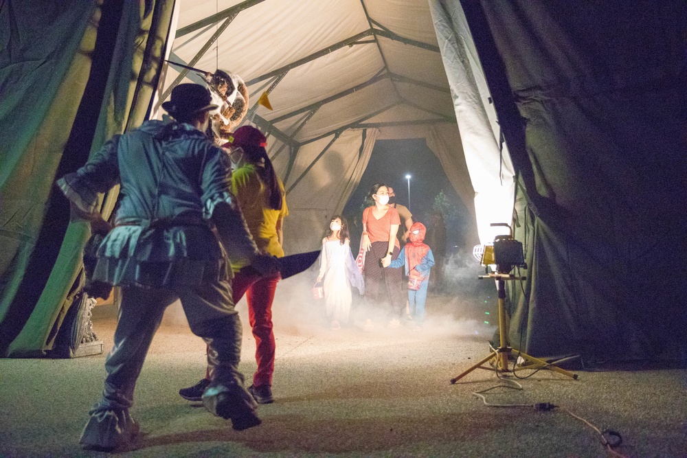Families walk through the All American Haunted Lane Event