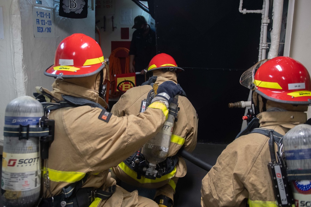 U.S. Navy Sailors fight a simulated fire during an in-port emergency drill aboard the aircraft carrier USS John C. Stennis (CVN 74) in Norfolk, Virginia, Oct. 24, 2020.