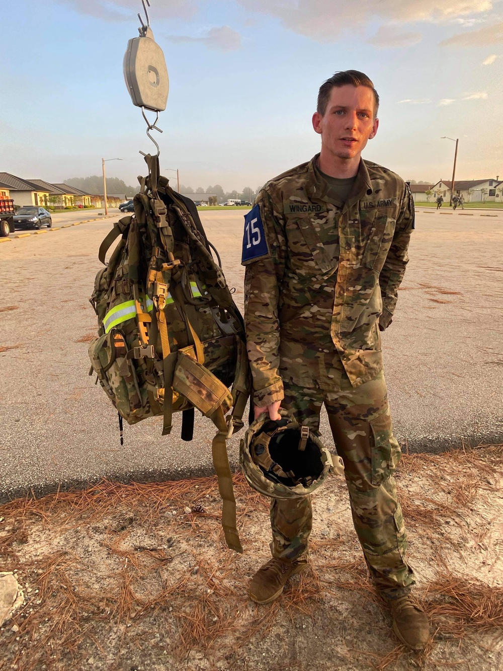 Soldier weighs ruck after march during Best Warrior Competition