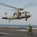 Helicopter Takes Off of Flight Deck