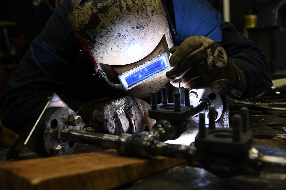 Hulll Maintenance Technician Reconstructs Pipe
