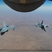 KC-135R Stratotanker refuels F-18 Hornet