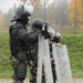 Albanian soldiers stand ready for crowd control training