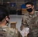 50th Contracting Squadron gives out hand sanitizer