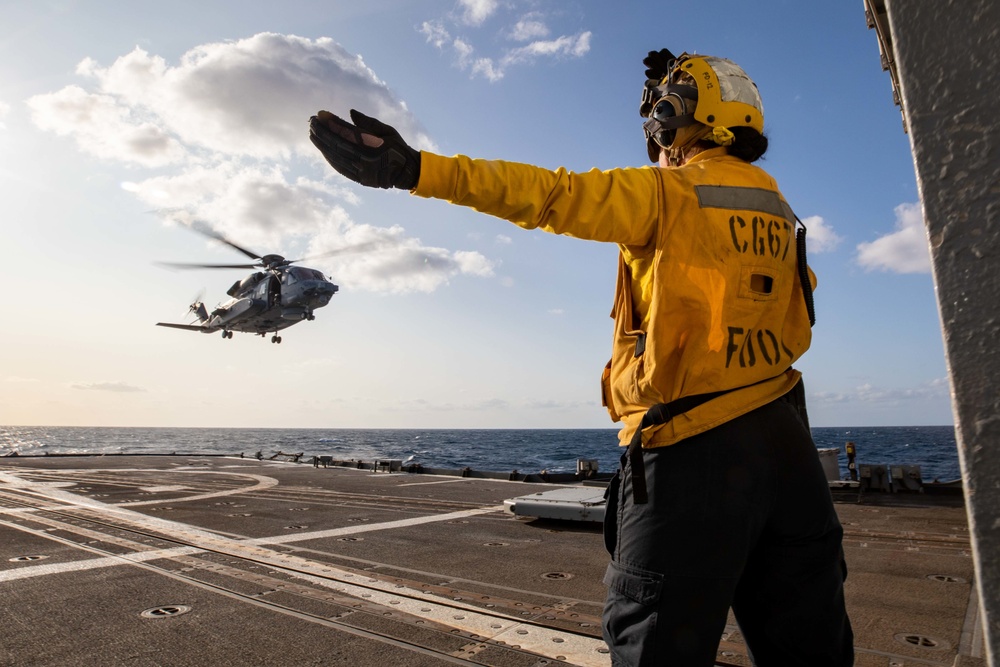 Boatswain's Mate Signal Canadian CH-148 during Keen Sword 21