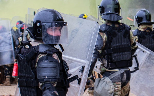 An Iowa Soldier responds to realistic riot scenario at JMRC