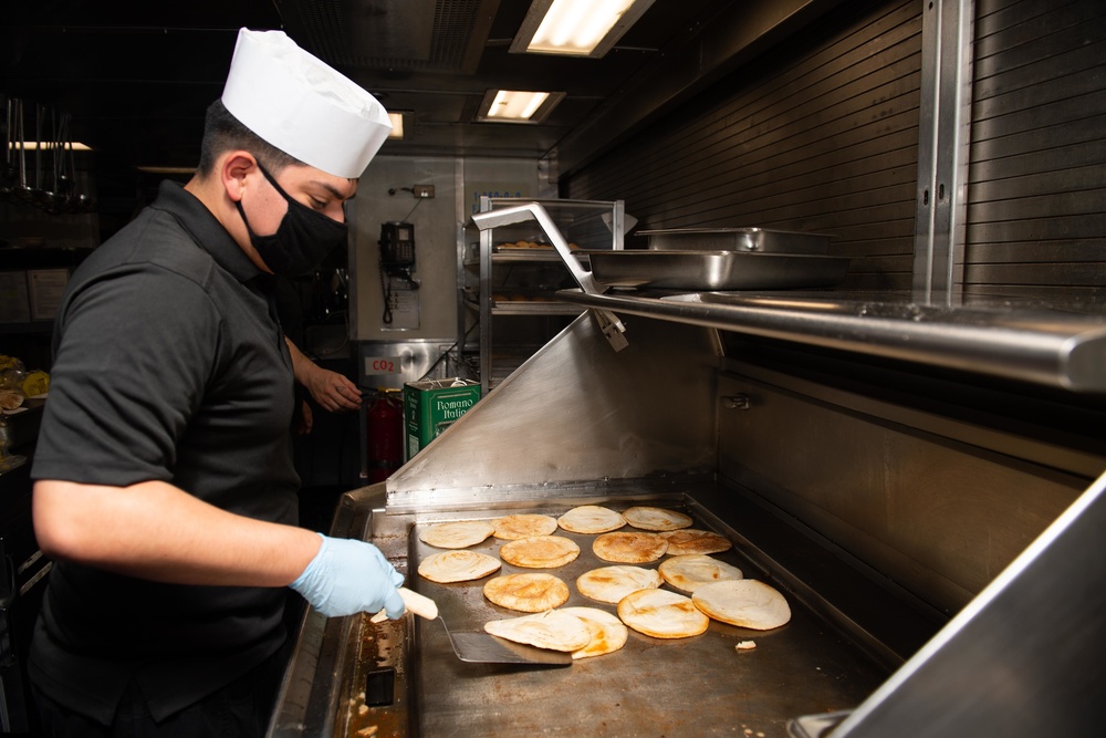 Culinary Specialists Prepare food aboard the USS Princeton